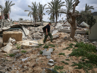 Simon Elmont from Humanity and Inclusion UK is examining and tagging large Israeli unexploded weapons to try to ensure maximum safety in Dei...