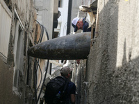 Members of Humanity and Inclusion UK are examining and marking significant Israeli unexploded weapons to try to ensure maximum safety in Dei...