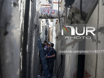 Members of Humanity and Inclusion UK are examining and marking significant Israeli unexploded weapons to try to ensure maximum safety in Dei...