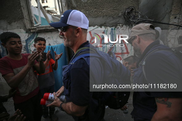 Members of Humanity and Inclusion UK are examining and marking significant Israeli unexploded weapons to try to ensure maximum safety in Dei...