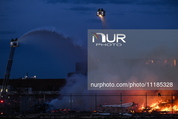 EDMONTON, CANADA - APRIL 22:
Several units of firefighters combat flames that tore through Edmonton's historic Hangar 11 on Monday evening,...