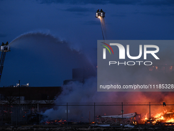 EDMONTON, CANADA - APRIL 22:
Several units of firefighters combat flames that tore through Edmonton's historic Hangar 11 on Monday evening,...