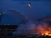 EDMONTON, CANADA - APRIL 22:
Several units of firefighters combat flames that tore through Edmonton's historic Hangar 11 on Monday evening,...