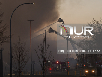 EDMONTON, CANADA - APRIL 22:
Emergency services at the scene as firefighters relentlessly combat flames that tore through Edmonton's histori...