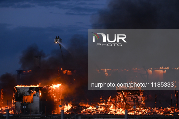 EDMONTON, CANADA - APRIL 22:
Several units of firefighters combat flames that tore through Edmonton's historic Hangar 11 on Monday evening,...