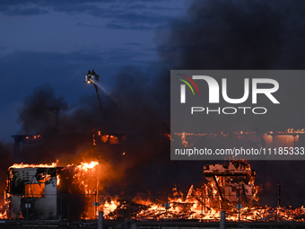 EDMONTON, CANADA - APRIL 22:
Several units of firefighters combat flames that tore through Edmonton's historic Hangar 11 on Monday evening,...