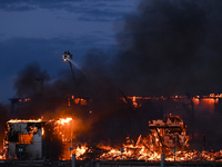 EDMONTON, CANADA - APRIL 22:
Several units of firefighters combat flames that tore through Edmonton's historic Hangar 11 on Monday evening,...