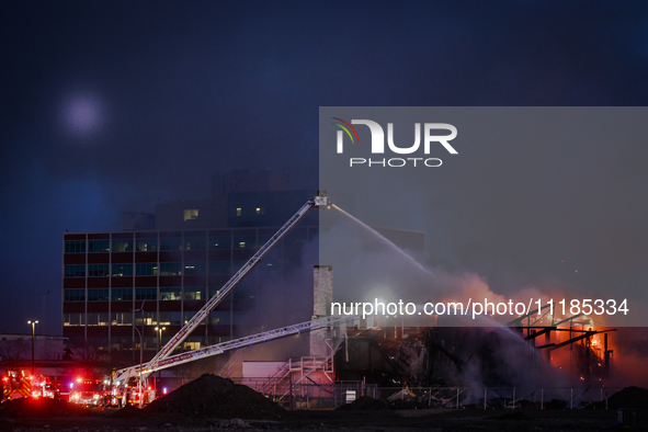 EDMONTON, CANADA - APRIL 22:
Several units of firefighters combat flames that tore through Edmonton's historic Hangar 11 on Monday evening,...