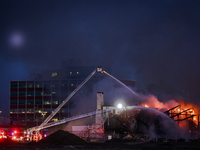 EDMONTON, CANADA - APRIL 22:
Several units of firefighters combat flames that tore through Edmonton's historic Hangar 11 on Monday evening,...