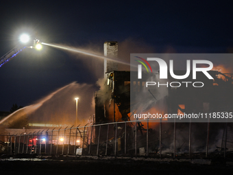 EDMONTON, CANADA - APRIL 22:
Firefighters relentlessly combat flames that tore through Edmonton's historic Hangar 11 on Monday evening, on A...