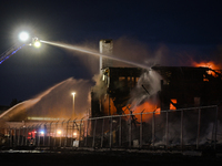 EDMONTON, CANADA - APRIL 22:
Firefighters relentlessly combat flames that tore through Edmonton's historic Hangar 11 on Monday evening, on A...