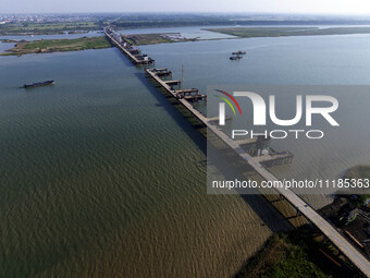 Workers are carrying out the construction of the steel pier bridge and the lower structure of the bridge across three river sections at the...