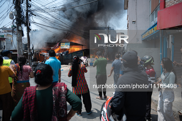 A fire is ravaging a vehicle workshop and adjacent shops in Sankhamul, Kathmandu, causing extensive damage on a Sunday afternoon. 