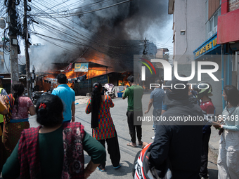 A fire is ravaging a vehicle workshop and adjacent shops in Sankhamul, Kathmandu, causing extensive damage on a Sunday afternoon. (