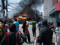 A fire is ravaging a vehicle workshop and adjacent shops in Sankhamul, Kathmandu, causing extensive damage on a Sunday afternoon. (