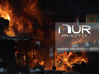 A fire is ravaging a vehicle workshop and adjacent shops in Sankhamul, Kathmandu, causing extensive damage on a Sunday afternoon. (