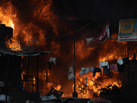 A fire is ravaging a vehicle workshop and adjacent shops in Sankhamul, Kathmandu, causing extensive damage on a Sunday afternoon. (