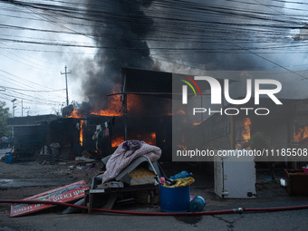 A fire is ravaging a vehicle workshop and adjacent shops in Sankhamul, Kathmandu, causing extensive damage on a Sunday afternoon. (