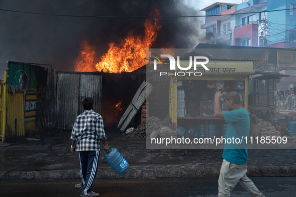 A fire is ravaging a vehicle workshop and adjacent shops in Sankhamul, Kathmandu, causing extensive damage on a Sunday afternoon. 