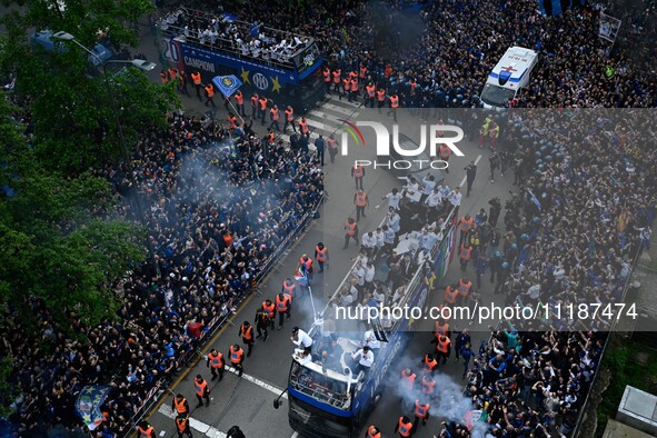 Inter FC players are celebrating their victory with fans during their bus parade, making a stop to celebrate on stage at the San Siro Stadiu...