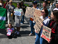 Participants are holding placards in support of the military held in Russian captivity during the FreeAzov action at the Taras Shevchenko mo...