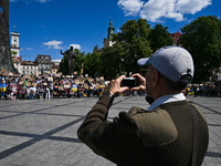 Participants are holding placards in support of the military held in Russian captivity during the FreeAzov action at the Taras Shevchenko mo...