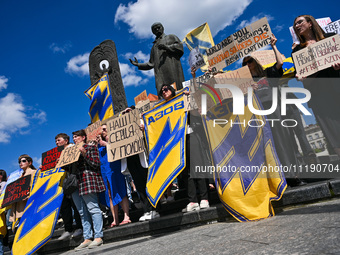 Participants are holding placards in support of the military held in Russian captivity during the FreeAzov action at the Taras Shevchenko mo...