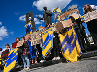 Participants are holding placards in support of the military held in Russian captivity during the FreeAzov action at the Taras Shevchenko mo...