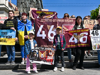 Participants are holding placards in support of the military held in Russian captivity during the FreeAzov action at the Taras Shevchenko mo...