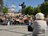 Participants are holding placards in support of the military held in Russian captivity during the FreeAzov action at the Taras Shevchenko mo...