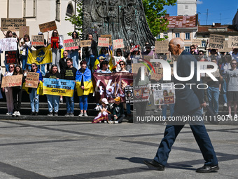 Participants are holding placards in support of the military held in Russian captivity during the FreeAzov action at the Taras Shevchenko mo...