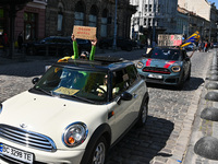 People in cars are holding placards during the FreeAzov action in support of the military held in Russian captivity in Lviv, Ukraine, on Apr...