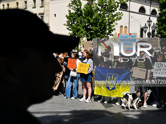 Participants are holding flags and placards in support of the military held in Russian captivity during the FreeAzov action at the square by...