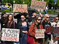 Participants are holding placards at the Taras Shevchenko monument in Lviv, Ukraine, on April 28, 2024, during the FreeAzov action in suppor...