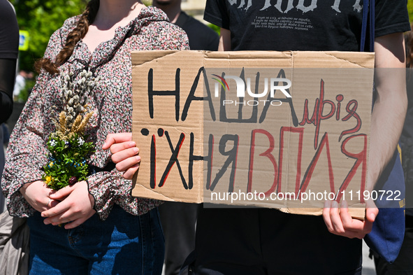 A placard is being displayed during the FreeAzov action in support of the military held in Russian captivity, at the square by the Taras She...