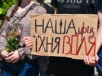 A placard is being displayed during the FreeAzov action in support of the military held in Russian captivity, at the square by the Taras She...