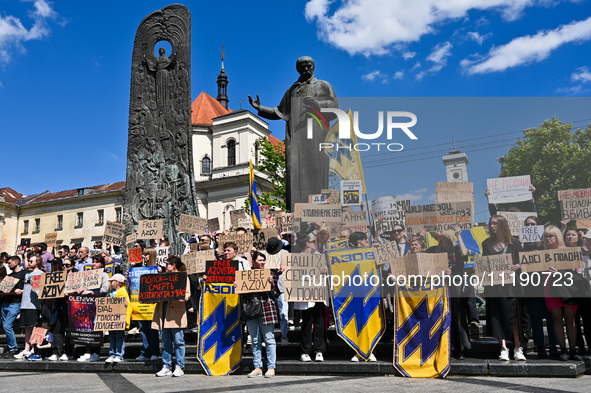 Participants are holding placards in support of the military detained in Russian captivity during the FreeAzov action at the Taras Shevchenk...