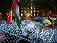 The sun rises on a Gaza solidarity encampment at George Washington University, Washington, DC, April, 29, 2024.  Overnight, students broke t...