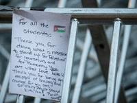 A thank you-note for students hangs on a barricade as the sun rises on the Gaza solidarity encampment at George Washington University, Washi...