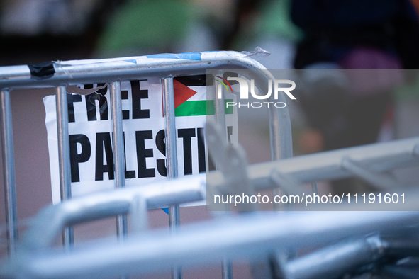 A sign hangs on a pile of barricades at a Gaza solidarity encampment at George Washington University, Washington, DC, April 29, 2024.  Overn...