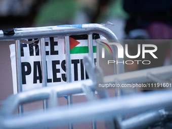 A sign hangs on a pile of barricades at a Gaza solidarity encampment at George Washington University, Washington, DC, April 29, 2024.  Overn...