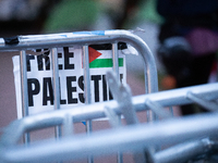 A sign hangs on a pile of barricades at a Gaza solidarity encampment at George Washington University, Washington, DC, April 29, 2024.  Overn...