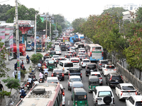 Commuters in Bangladesh are sitting in a traffic jam along a main road during a heatwave in Dhaka on April 29, 2024. (