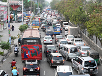 Commuters in Bangladesh are sitting in a traffic jam along a main road during a heatwave in Dhaka on April 29, 2024. (