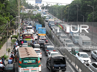 Commuters in Bangladesh are sitting in a traffic jam along a main road during a heatwave in Dhaka on April 29, 2024. (