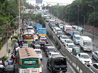 Commuters in Bangladesh are sitting in a traffic jam along a main road during a heatwave in Dhaka on April 29, 2024. (