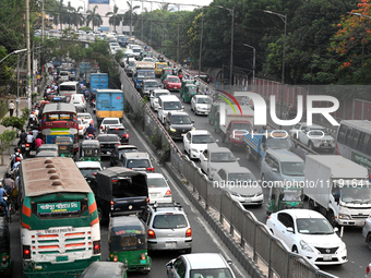 Commuters in Bangladesh are sitting in a traffic jam along a main road during a heatwave in Dhaka on April 29, 2024. (