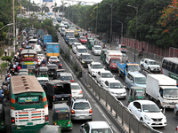 Commuters in Bangladesh are sitting in a traffic jam along a main road during a heatwave in Dhaka on April 29, 2024. (