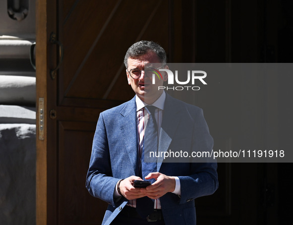 Ukrainian Foreign Minister Dmytro Kuleba is standing before a press conference of NATO Secretary General Jens Stoltenberg and President of U...