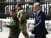 NATO Secretary General Jens Stoltenberg (L) and President of Ukraine Volodymyr Zelensky (R) are arriving to meet the media following their n...